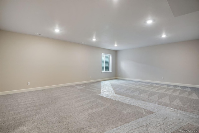 3443 N Gold Bug Ct, Aurora, CO 80019 - unfurnished room with visible vents, light carpet, baseboards, and recessed lighting