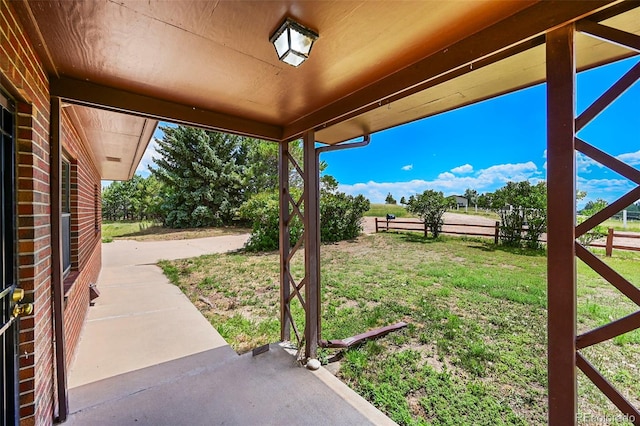 view of yard featuring a patio and fence