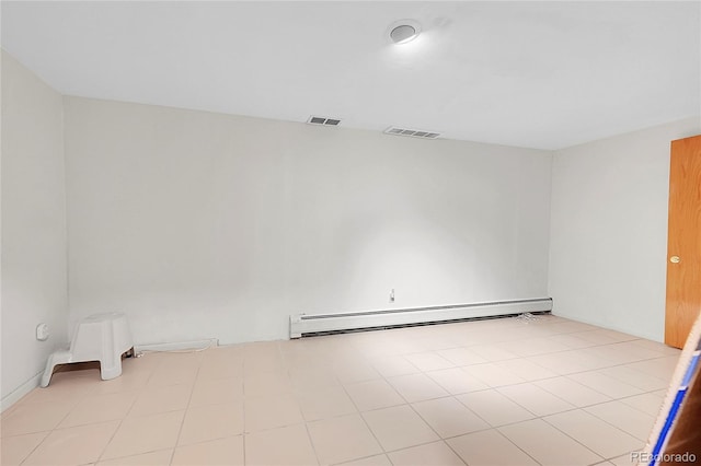 empty room with visible vents and baseboard heating