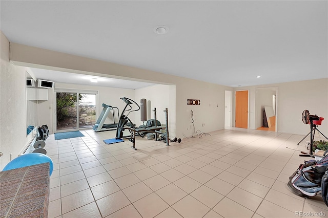 exercise area with light tile patterned floors