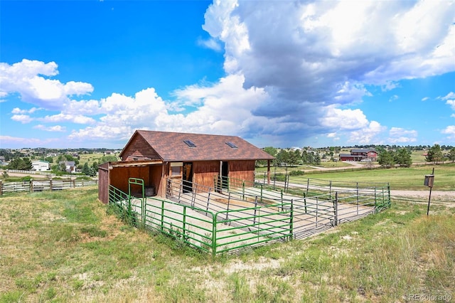 view of stable featuring a rural view