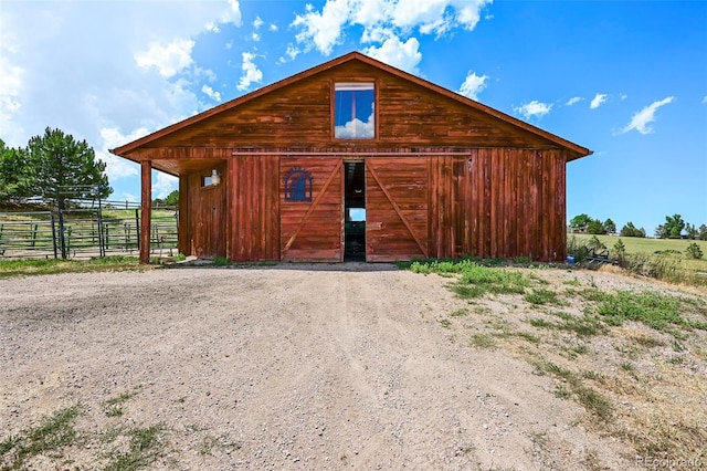 view of outdoor structure featuring an exterior structure, an outdoor structure, and a rural view