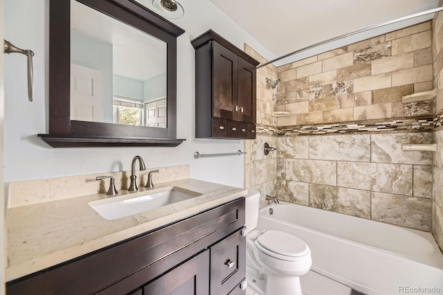 full bath featuring vanity, toilet, and bathtub / shower combination