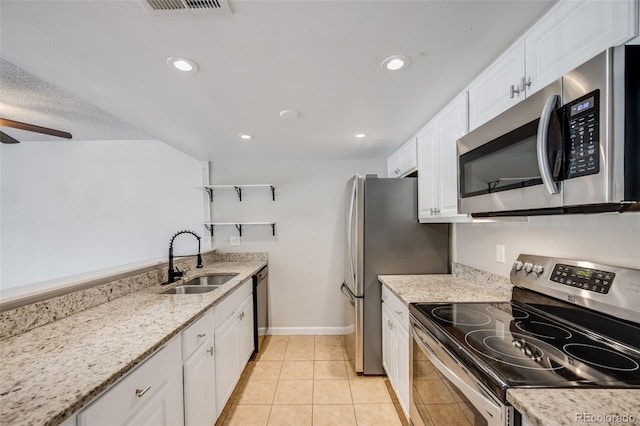 401 S Kalispell Way Unit 206, Aurora, CO 80017 - kitchen featuring stainless steel appliances, white cabinets, recessed lighting, a ceiling fan, and light tile patterned flooring