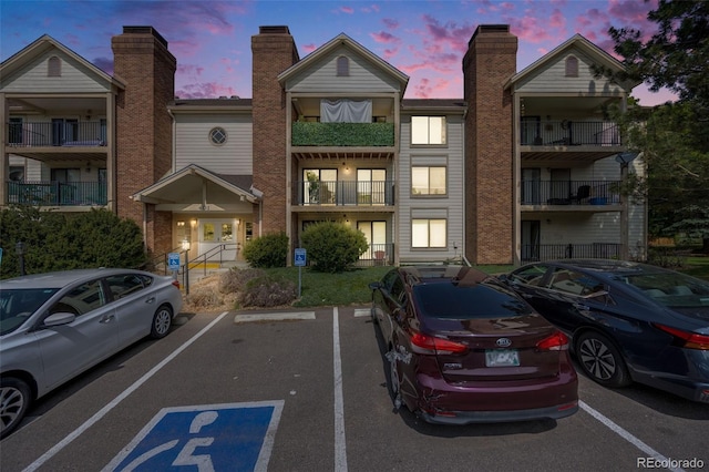 401 S Kalispell Way Unit 206, Aurora, CO 80017 - property at dusk with uncovered parking
