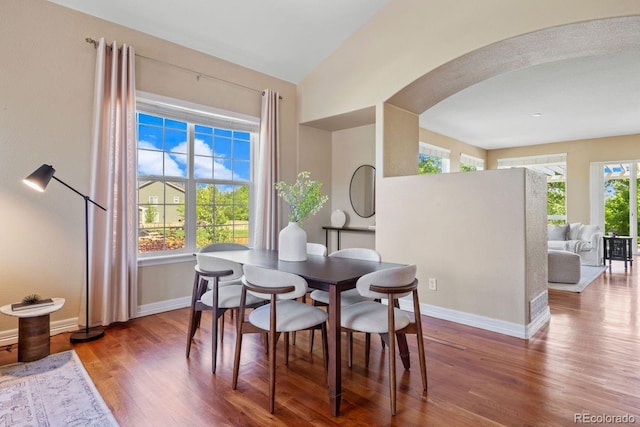 7472 Iridium Way, Castle Rock, CO 80108 - dining space with wood finished floors and arched walkways