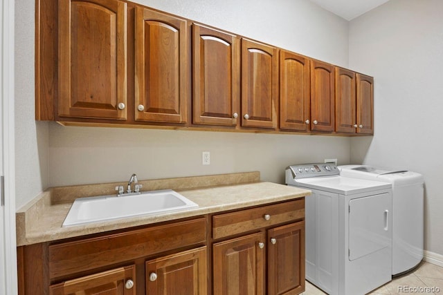 7472 Iridium Way, Castle Rock, CO 80108 - laundry area featuring cabinet space, separate washer and dryer, and light tile patterned floors