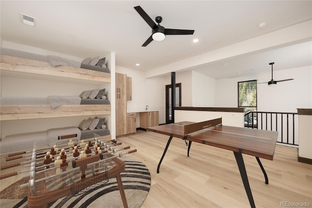 interior space with light hardwood / wood-style floors and ceiling fan