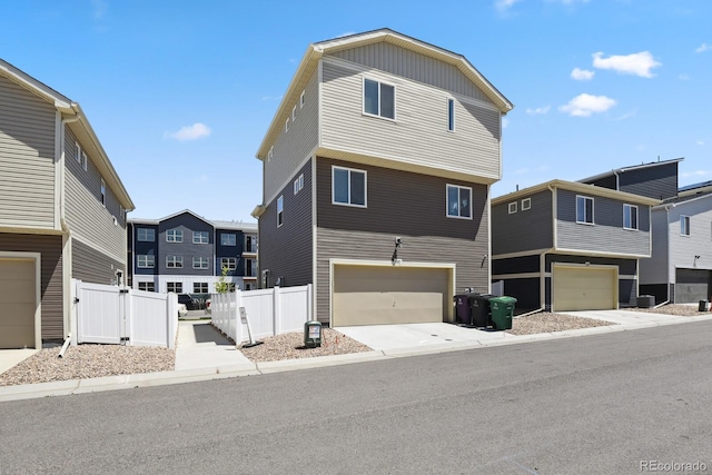 5121 N Yampa St, Denver, CO 80249 - view of front facade with an attached garage and driveway