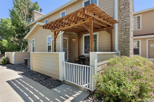 8452 Everett Way Unit C, Arvada, CO 80005 - view of front of home featuring a pergola and a chimney