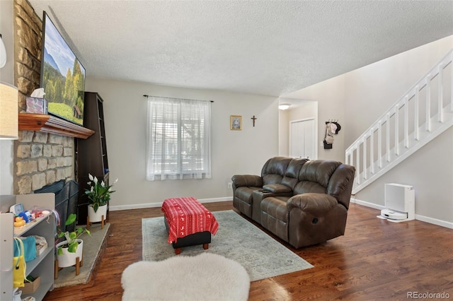 8452 Everett Way Unit C, Arvada, CO 80005 - living room with a textured ceiling, stairs, and dark wood finished floors