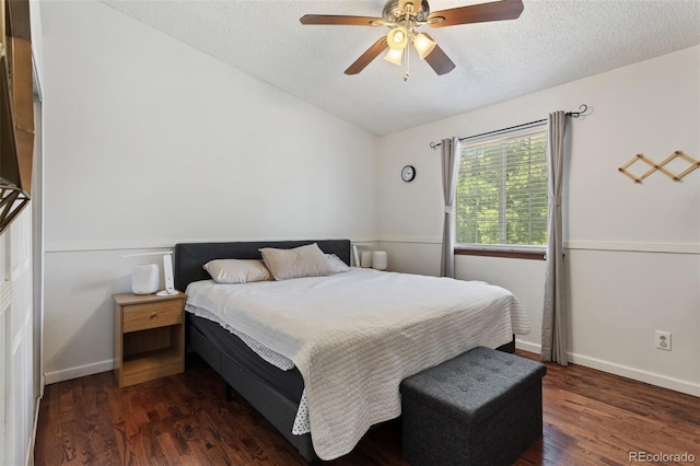8452 Everett Way Unit C, Arvada, CO 80005 - bedroom featuring dark wood finished floors, vaulted ceiling, a textured ceiling, and a ceiling fan