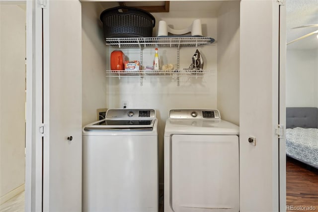 8452 Everett Way Unit C, Arvada, CO 80005 - washroom with washing machine and dryer and wood finished floors