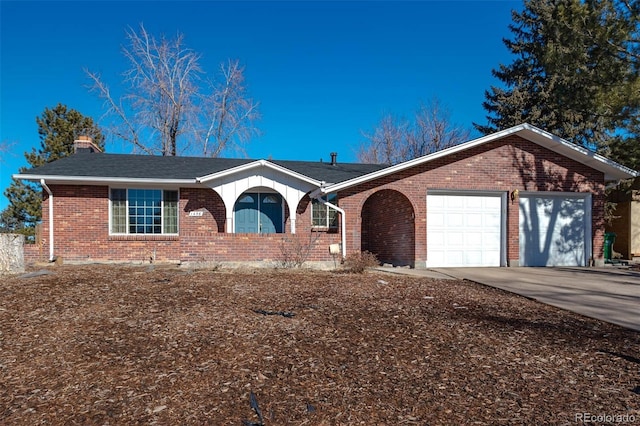 ranch-style home featuring a garage