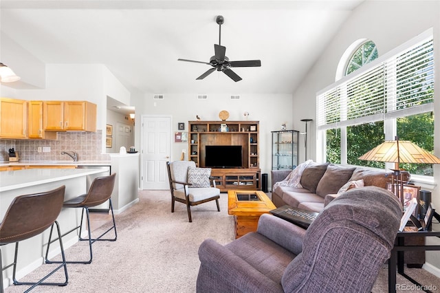 4501 Nelson Rd Unit 2201, Longmont, CO 80503 - living area with light colored carpet, ceiling fan, and lofted ceiling