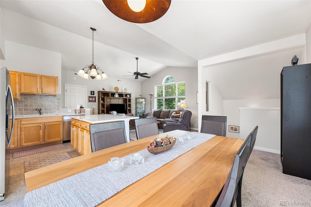 4501 Nelson Rd Unit 2201, Longmont, CO 80503 - dining space featuring a ceiling fan, lofted ceiling, a chandelier, and light carpet