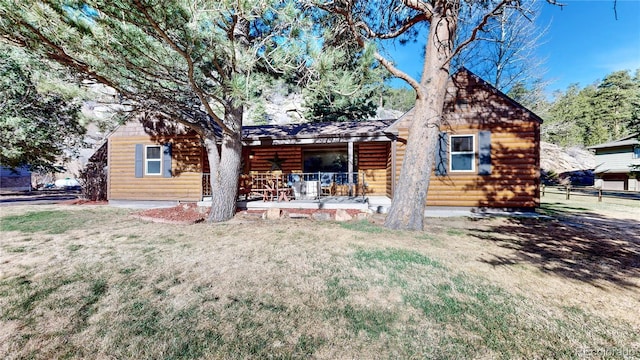 7 Rock Canyon Rd, Drake, CO 80515 - view of front of house featuring a front lawn and log veneer siding