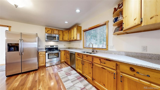 7 Rock Canyon Rd, Drake, CO 80515 - kitchen with a sink, light wood-type flooring, light stone countertops, appliances with stainless steel finishes, and recessed lighting