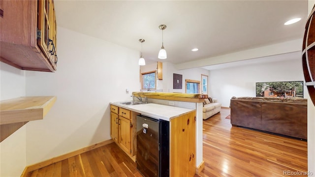 7 Rock Canyon Rd, Drake, CO 80515 - kitchen with light wood finished floors, a peninsula, recessed lighting, and beverage cooler