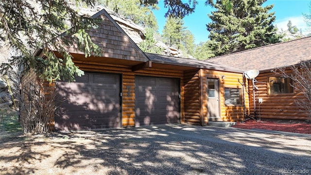7 Rock Canyon Rd, Drake, CO 80515 - view of front facade with driveway, a shingled roof, and a garage