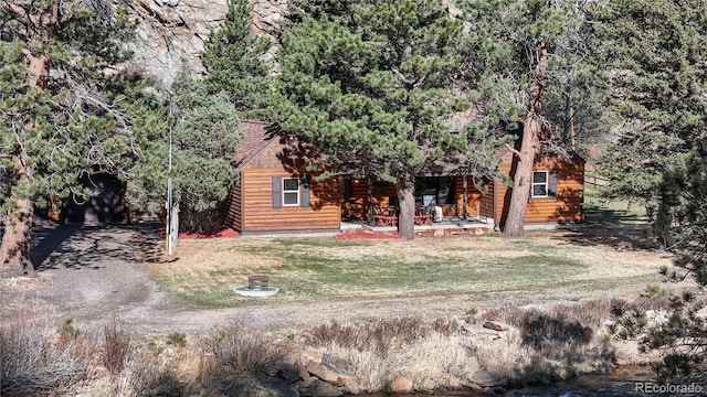 7 Rock Canyon Rd, Drake, CO 80515 - view of front facade featuring faux log siding and covered porch