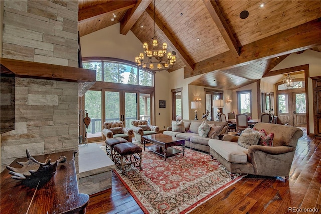 living room with beam ceiling, french doors, an inviting chandelier, hardwood / wood-style flooring, and high vaulted ceiling