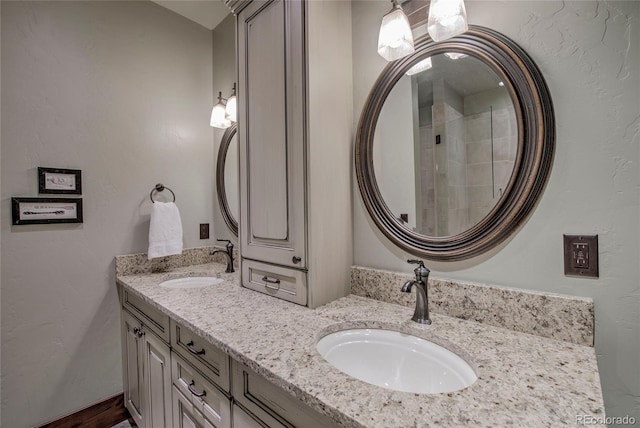 bathroom with a sink and double vanity