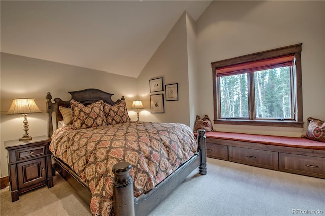 bedroom featuring light carpet and lofted ceiling