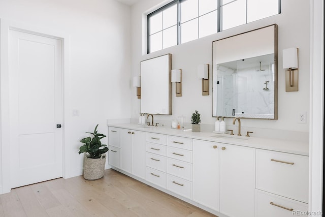 3530 Fenton St, Wheat Ridge, CO 80212 - full bathroom with a marble finish shower, wood finished floors, and double vanity