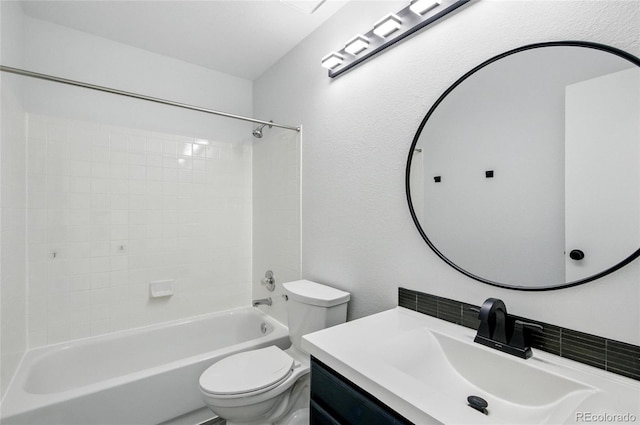bathroom with toilet, vanity, and shower / bath combination