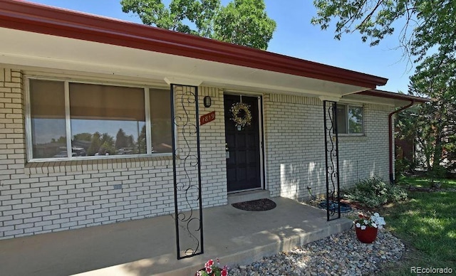 entrance to property with covered porch