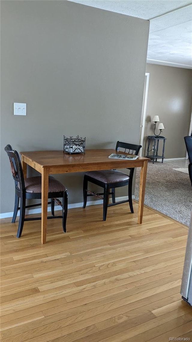 dining area with light wood-type flooring