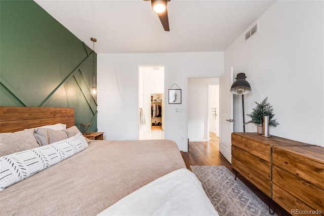 bedroom featuring ceiling fan and dark hardwood / wood-style flooring