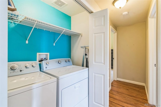 1771 W 53rd Pl Unit 2, Denver, CO 80221 - laundry area with washing machine and dryer, wood finished floors, and baseboards