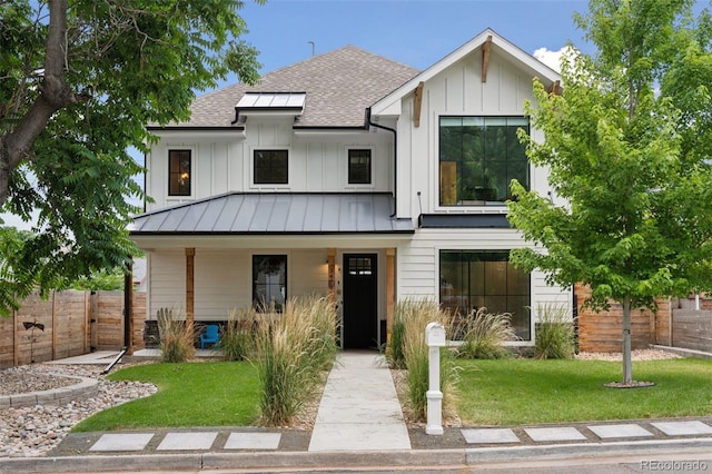 3478 Chase St, Wheat Ridge, CO 80212 - modern inspired farmhouse with a standing seam roof, roof with shingles, covered porch, and board and batten siding