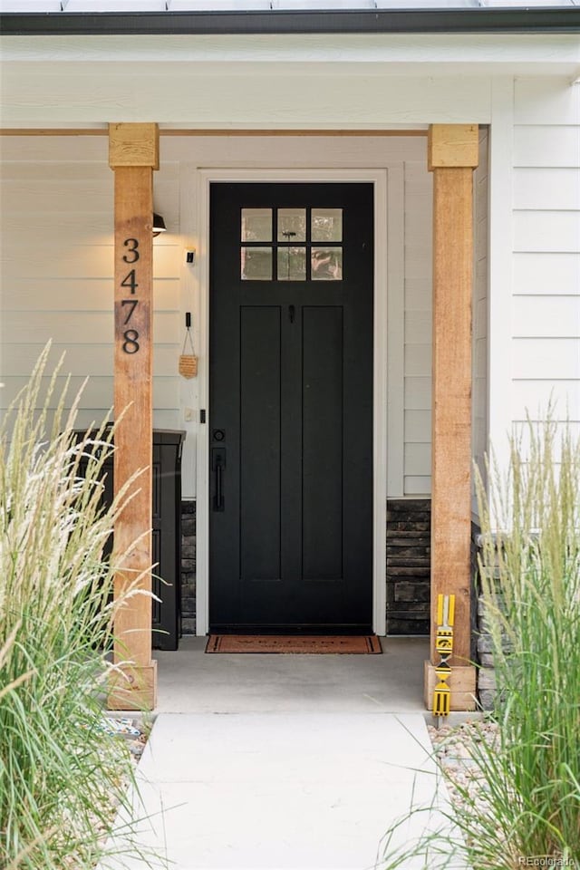 3478 Chase St, Wheat Ridge, CO 80212 - entrance to property featuring board and batten siding