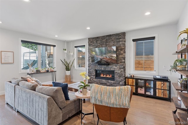 3478 Chase St, Wheat Ridge, CO 80212 - living area featuring a stone fireplace, recessed lighting, and wood finished floors