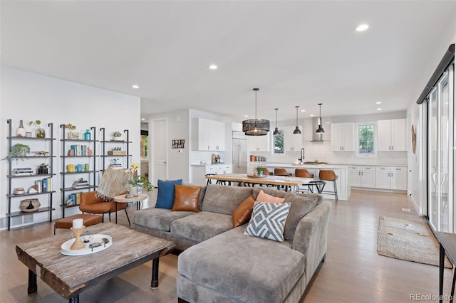 3478 Chase St, Wheat Ridge, CO 80212 - living area with light wood finished floors and recessed lighting