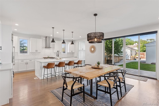 3478 Chase St, Wheat Ridge, CO 80212 - dining space with light wood finished floors and recessed lighting