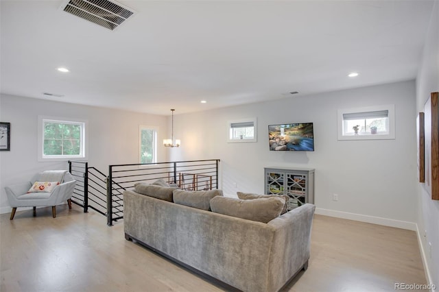 3478 Chase St, Wheat Ridge, CO 80212 - living area with a chandelier, light wood finished floors, and recessed lighting
