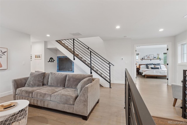 3478 Chase St, Wheat Ridge, CO 80212 - living area featuring light wood-type flooring, recessed lighting, and stairs