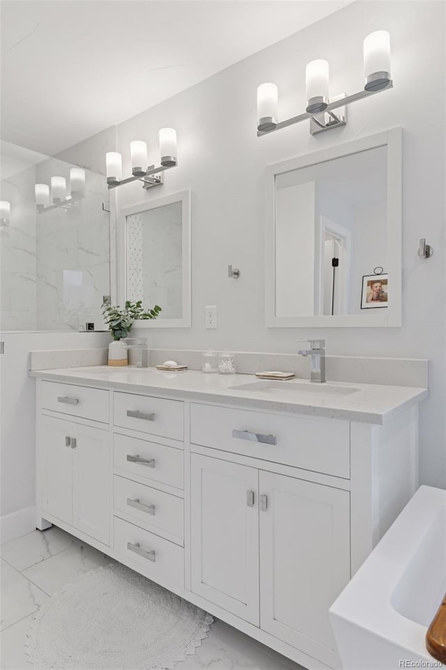3478 Chase St, Wheat Ridge, CO 80212 - bathroom featuring marble finish floors, double vanity, and a marble finish shower