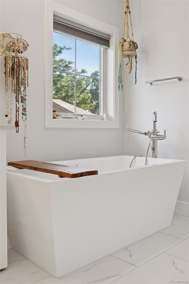 3478 Chase St, Wheat Ridge, CO 80212 - bathroom featuring marble finish floors and a soaking tub