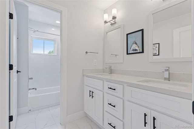 3478 Chase St, Wheat Ridge, CO 80212 - full bathroom with double vanity, marble look tile flooring, and washtub / shower combination