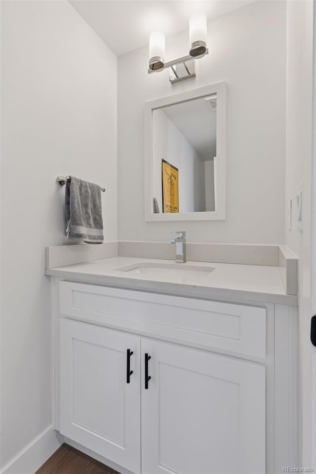 3478 Chase St, Wheat Ridge, CO 80212 - bathroom with vanity and baseboards