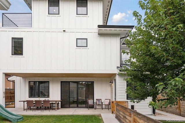 3478 Chase St, Wheat Ridge, CO 80212 - back of house featuring board and batten siding and a patio