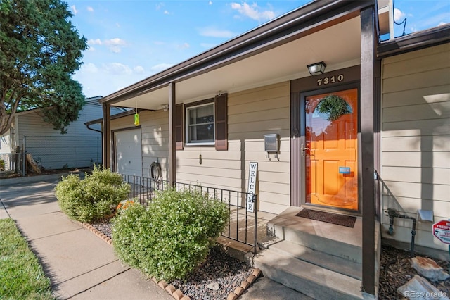 7310 Granada Rd, Denver, CO 80221 - doorway to property with covered porch