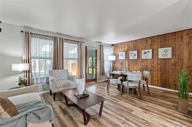 7310 Granada Rd, Denver, CO 80221 - living area featuring light wood-style flooring and wooden walls