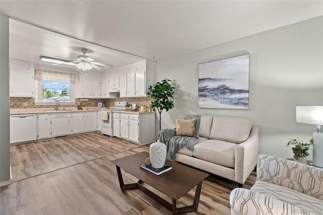 7310 Granada Rd, Denver, CO 80221 - living room with light wood-style flooring and a ceiling fan
