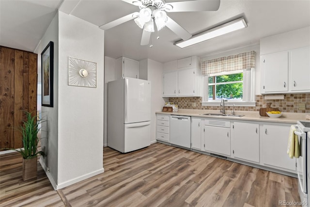 7310 Granada Rd, Denver, CO 80221 - kitchen featuring white appliances, tasteful backsplash, and white cabinetry